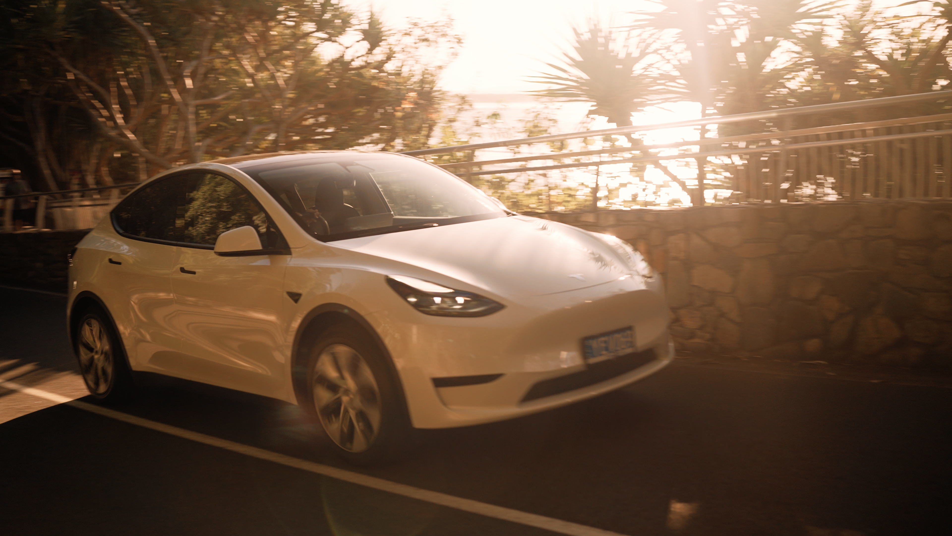 Electric vehicle on the coastal drive from Brisbane Airport to Noosa